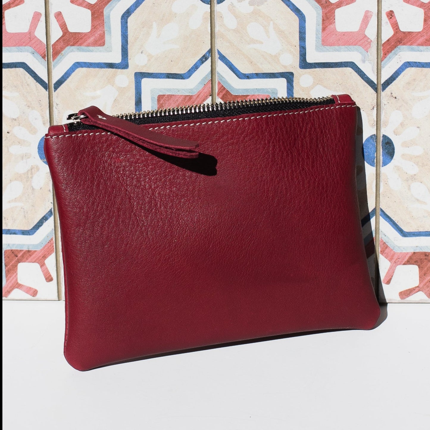 Cartera de cuero granate